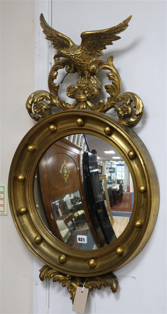 A Regency style gilt framed convex wall mirror H.84cm